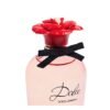 Close-up of Dolce and Gabbana Dolce Rose bottle with black bow and red rose cap